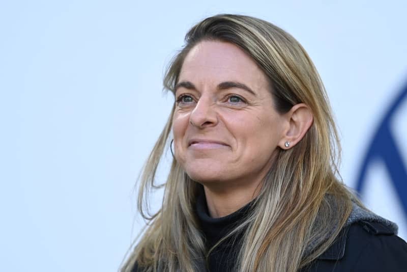 Nia Kuenzer, sports director for women's soccer at the German Football Association (DFB), stands in the stadium before the German Bundesliga soccer match between VfL Wolfsburg and Bayern Munich at Volkswagen Arena. German Football Federation (DFB) women's director Nia Künzer said that Germany, Belgium and the Netherlands have "excellent arguments" to become the hosts of the 2027 women's World Cup together. Swen Pförtner/dpa