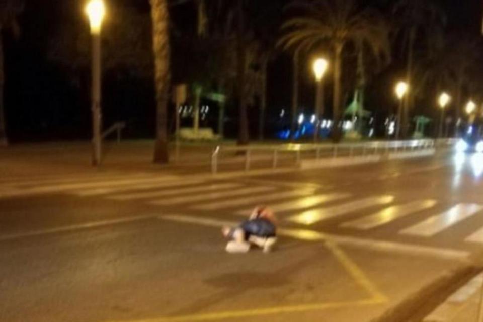 The body of one of the Cambrils attackers strewn in the street after being shot deadt (Twitter)