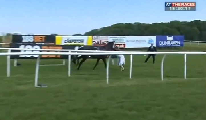 TV presenter Hayley Moore tackles a loose racehorse (At The Races)