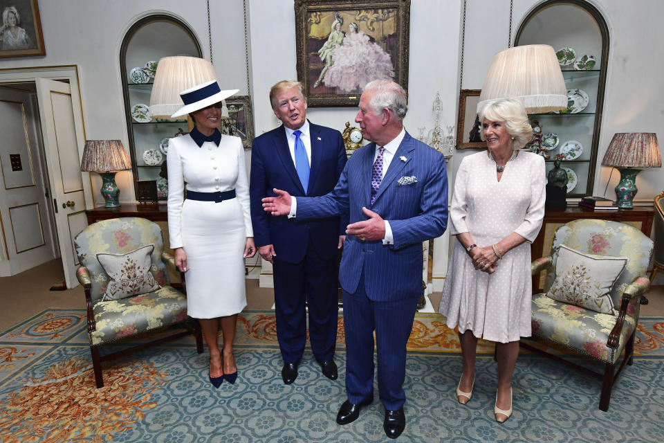 US President Donald Trump, centre left and his wife, first lady Melania, left, listen to Britain's Prince Charles and Camilla, the Duchess of Cornwall prior to afternoon tea at Clarence House, in London, Monday, June 3, 2019. Trump is on a three-day state visit to Britain. (Victoria Jones/Pool Photo via AP)