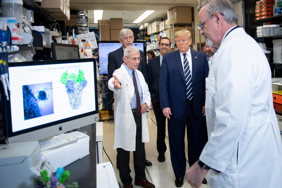 National Institute of Allergy and Infectious Diseases Director Tony Fauci (L) speaks to US President Donald Trump during a tour of the National Institutes of Health's Vaccine Research Center March 3, 2020, in Bethesda, Maryland. - The US Federal Reserve announced an emergency rate cut responding to the growing economic risk posed by the coronavirus epidemic after the UN health agency said the world has entered "uncharted territory" with the outbreak's rapid spread. (Photo by Brendan Smialowski / AFP) (Photo by BRENDAN SMIALOWSKI/AFP via Getty Images)