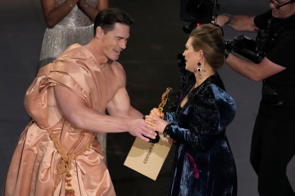 Cena later gave the award to “Poor Things.” Chris Pizzello/Invision/AP