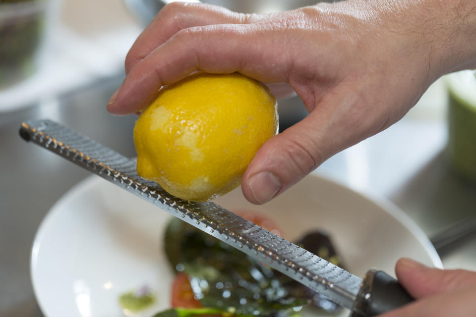 Zesting a lemon on a microplane