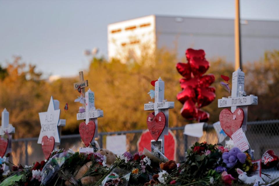 A memorial is made outside the Marjory Stoneman Douglas High School in Parkland, Florida (Copyright 2018 The Associated Press. All rights reserved.)