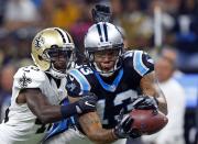 <p>Carolina Panthers wide receiver Kelvin Benjamin (13) tries to pull in a pass as New Orleans Saints cornerback Ken Crawley (46) covers in the first half of an NFL football game in New Orleans, Sunday, Oct. 16, 2016. (AP Photo/Butch Dill) </p>