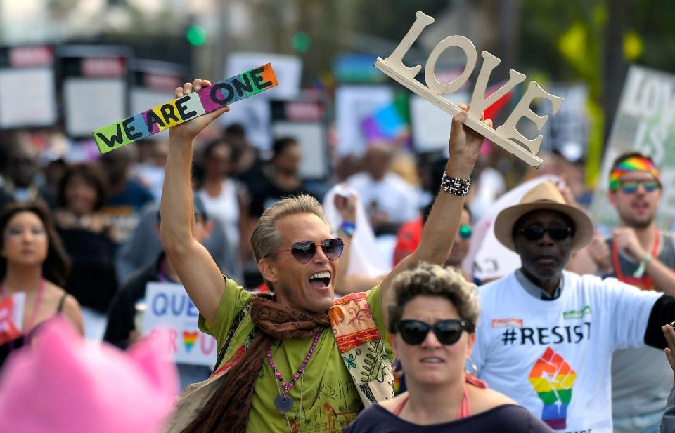 A marcher celebrates in Los Angeles