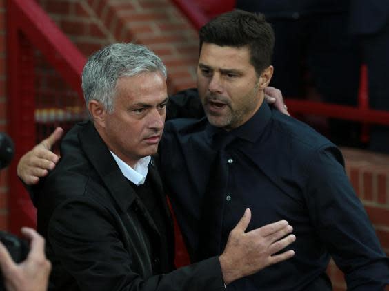 Jose Mourinho and Mauricio Pochettino at a meeting between United and Tottenham last year at Old Trafford (Getty)