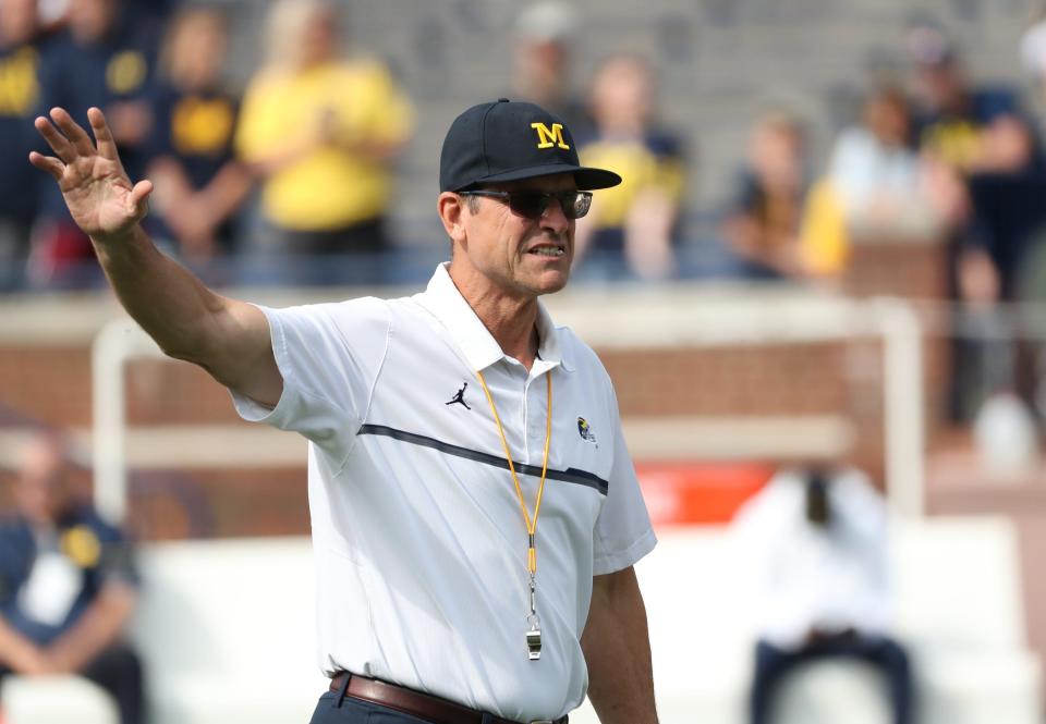 Michigan coach Jim Harbaugh on the field before the game against Western Michigan on Saturday, Sept. 4, 2021, in Ann Arbor.