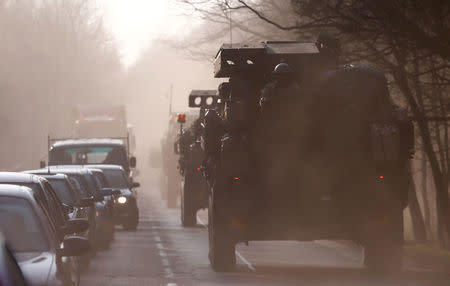 A convoy of U.S. troops, a part of NATO's reinforcement of its eastern flank, who are on their way from Germany to Orzysz in northeast Poland, drive through Sulejowek towards a military base in Wesola, near Warsaw, Poland, March 28, 2017. REUTERS/Kacper Pempel