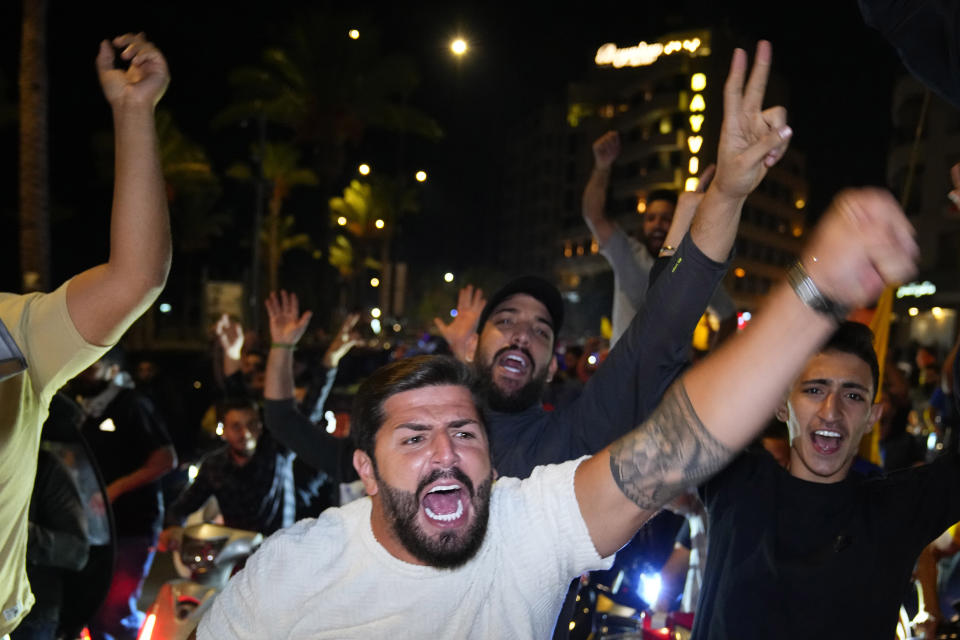 Hezbollah supporters chant slogans during a protest in solidarity with the Palestinian people in Gaza, in Beirut, Lebanon, Tuesday, Oct. 17, 2023. Groups of protesters roamed the city on motorcycles and gathered outside the French embassy, and the headquarters of the U.N. Economic and Social Commission for Western Asia. They were unable to reach the heavily fortified U.S. embassy compound in the hills north of Beirut. (AP Photo/Bilal Hussein)