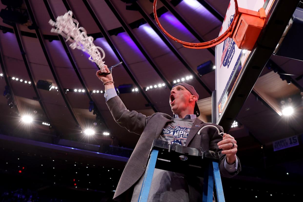March 16: UConn coach Dan Hurley cuts down the net after the Huskies won the Big East tournament.