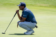 Sebastián Muñoz, of Colombia, looks over the green before putting on the 18th hole during the first round of the AT&T Byron Nelson golf tournament in McKinney, Texas, on Thursday, May 12, 2022. (AP Photo/Emil Lippe)