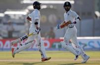 Cricket - Sri Lanka v India - First Test Match - Galle, Sri Lanka - July 28, 2017 - India's captain Virat Kohli and Abhinav Mukund run between wickets . REUTERS/Dinuka Liyanawatte