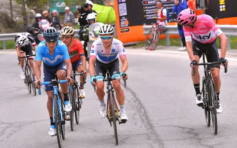 Chris Froome (right) powers up the slopes - Credit: GETTY IMAGES