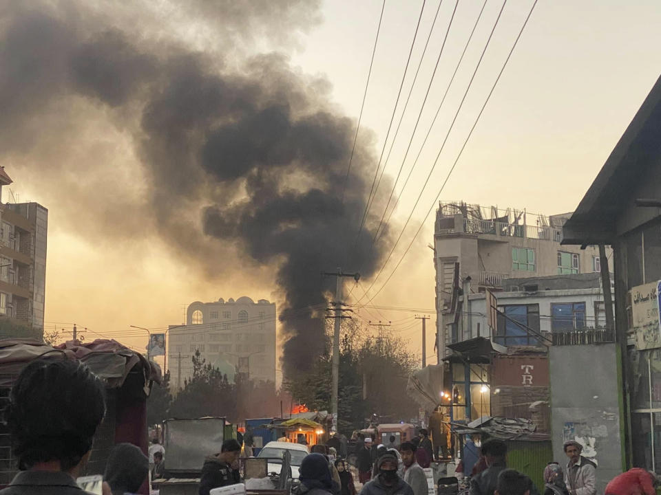 Smoke rise on the sky following a bomb explosion in Kabul, Afghanistan, on Saturday, Nov. 13, 2021. Emergency workers say a bomb has exploded on a mini-bus on a busy commercial street in a Kabul neighborhood mainly populated by members of Afghanistan’s minority Hazara community. (AP Photo)