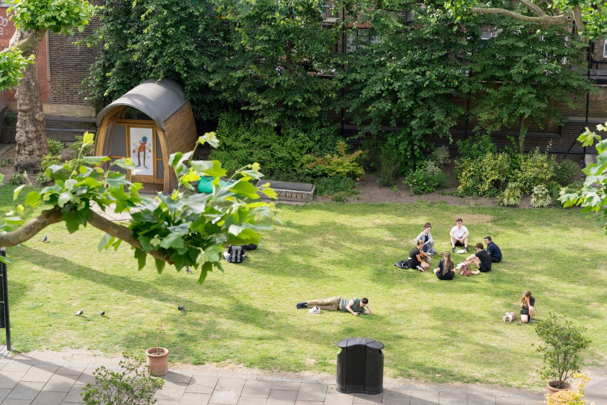 London, UK, 27th June 2024. UK Weather: London Soho church yard pack with sun seekers in the summer afternoon as heat waves fizzles out, with severe gales and heavy rain on its way to hit part of UK. Credit: Xiu Bao/Alamy Live News