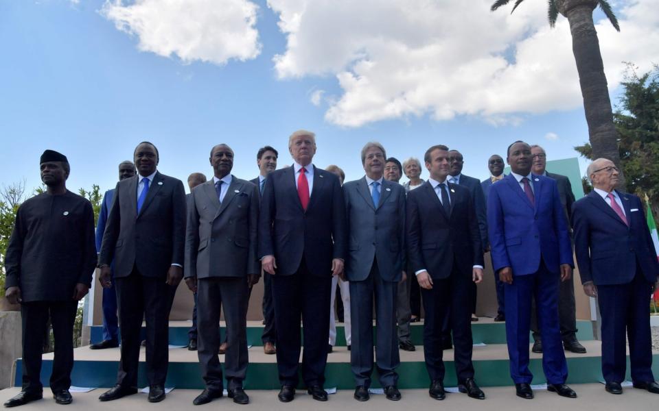 Leaders of the G7 and leaders of some African countries that have been invited for the two-day talks pose for a family photo on the second day of the G7 summit of Heads of State and of Government, on May 27, 2017 in Taormina, Sicily - Credit: AFP