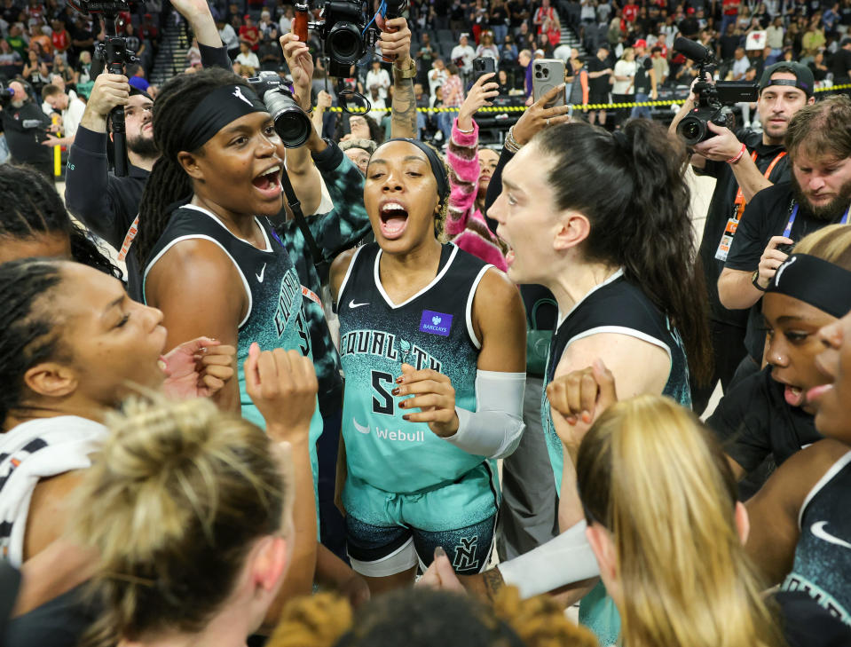 LAS VEGAS, NEVADA - OCTOBER 06: The New York Liberty, including (L-R) Jonquel Jones #35, Kayla Thornton #5 and Breanna Stewart #30, celebrate on the court after defeating the Las Vegas Aces 76-62 in Game Four of the 2024 WNBA Playoffs semifinals to win the series three games to one at Michelob ULTRA Arena on October 06, 2024 in Las Vegas, Nevada. NOTE TO USER: User expressly acknowledges and agrees that, by downloading and or using this photograph, User is consenting to the terms and conditions of the Getty Images License Agreement. (Photo by Ethan Miller/Getty Images)