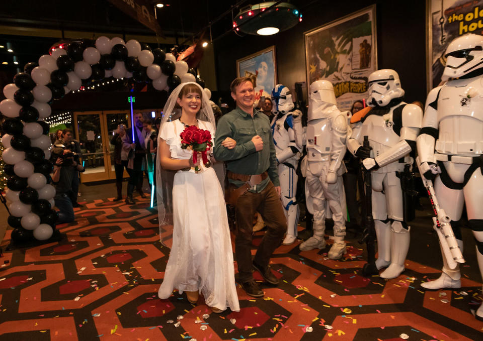 "Star Wars' fans Wendee and Andy Forbes marry in the lobby of the Alamo Drafthouse Cinema in Austin, Texas, before the premiere screening of "The Rise of Skywalker." (Photo: Erika Rich)