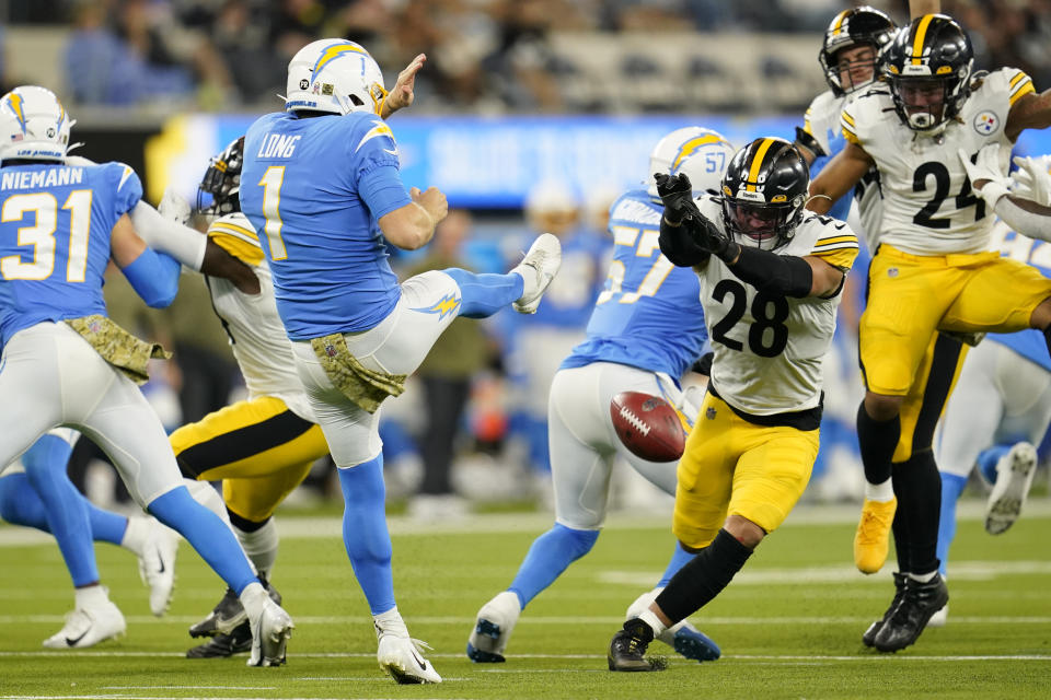 Pittsburgh Steelers safety Miles Killebrew (28) blocks a punt by Los Angeles Chargers punter Ty Long (1) during the second half of an NFL football game Sunday, Nov. 21, 2021, in Inglewood, Calif. (AP Photo/Marcio Jose Sanchez)