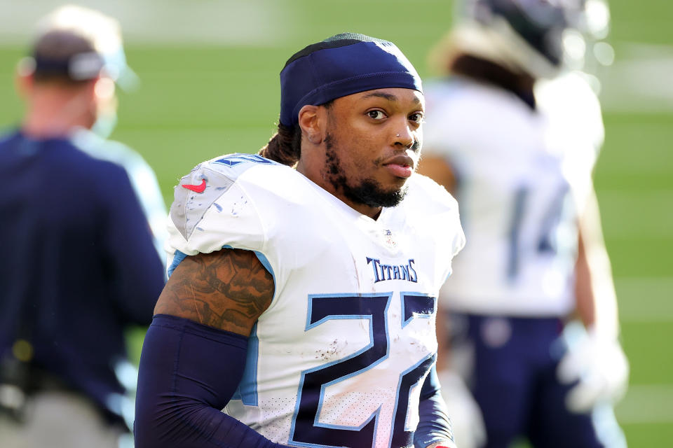 HOUSTON, TEXAS - JANUARY 03: Derrick Henry #22 of the Tennessee Titans watches action during the first half against the Houston Texans at NRG Stadium on January 03, 2021 in Houston, Texas. (Photo by Carmen Mandato/Getty Images)