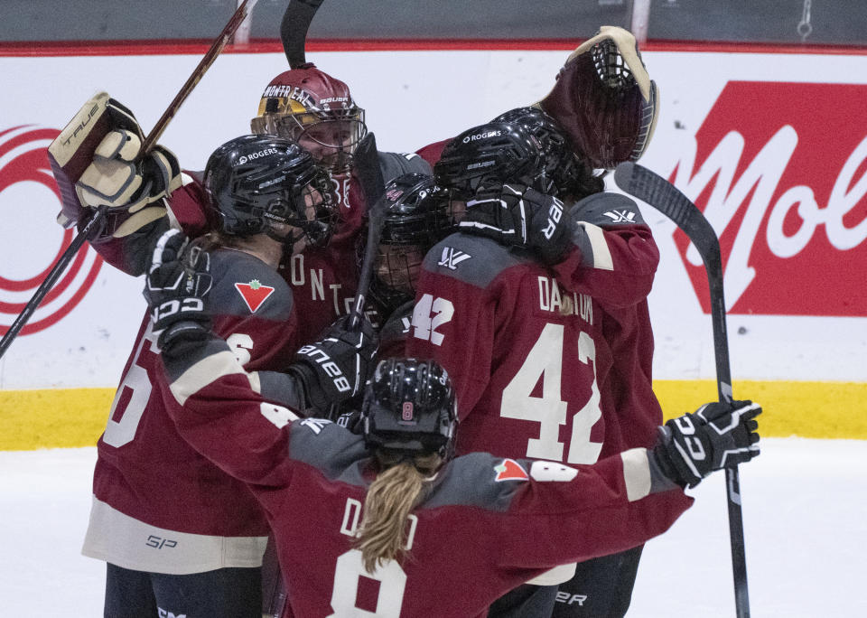 Montreal goaltender Ann-Renee Desbiens and teammates celebrate a win over New York in a PWHL hockey game Wednesday, April 24, 2024, in Montreal. (Christinne Muschi/The Canadian Press via AP)