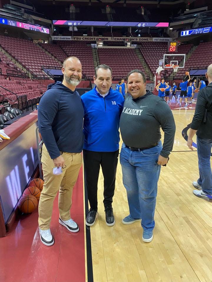 David Ross, left, with Duke basketball coach Mike Krzyzewski and Tallahassee author Don Yaeger.