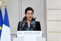 French Health and Solidarity Minister Agnes Buzyn delivers a speech at the Elysee Presidential Palace after a weekly cabinet meeting and an official presentation of the pension overhaul reform, Friday, Jan.24, 2020 in Paris. French unions are holding last-ditch strikes and protests around the country Friday as the government unveils a divisive bill redesigning the national retirement system. ( Alain Jocard/Pool via AP)