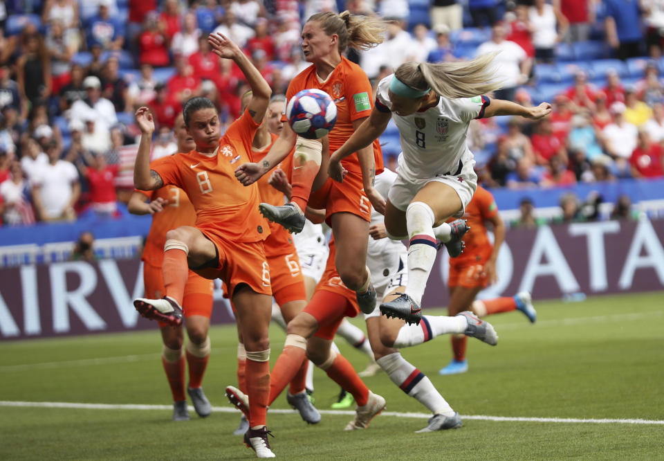 United States' Julie Ertz, right, attempts a header at goal during the Women's World Cup final soccer match between US and The Netherlands at the Stade de Lyon in Decines, outside Lyon, France, Sunday, July 7, 2019. (AP Photo/Francisco Seco)