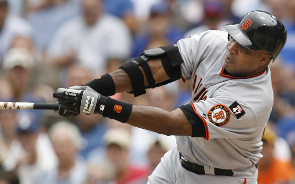 FILE - San Francisco Giants' Barry Bonds hits a single against the Chicago Cubs during the third inning of a baseball game Thursday, July 19, 2007, in Chicago. Barry Bonds, Roger Clemens and Curt Schilling were passed over by a Baseball Hall of Fame committee that elected former big league slugger Fred McGriff to Cooperstown on Sunday, Dec. 4, 2022. (AP Photo/Nam Y. Huh, File)