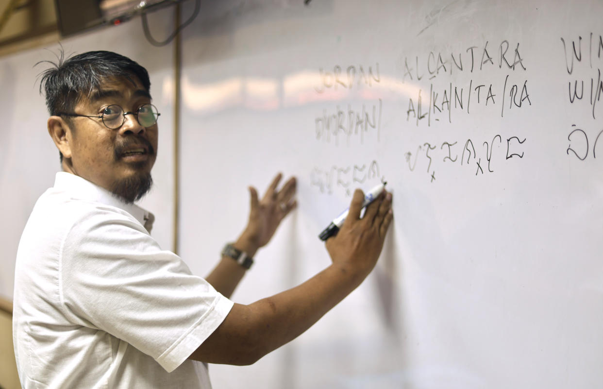 Jay Enage, a Baybayin Instructor, teaches a workshop at Pasay National Science High School in Manila. (Jordan Winters)