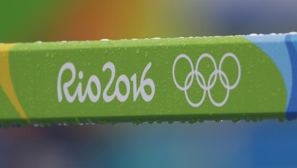 FILE - Raindrops on a hurdle during the Summer Olympics in Rio de Janeiro, Brazil, Friday, Aug. 12, 2016. The International Olympic Committee has signed Anheuser-Busch InBev as the first beer brand in the 40-year history of its sponsorship program, which earns billions of dollars for the organization and international sports. (AP Photo/Matt Slocum, File)