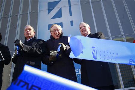 New York City Mayor Michael Bloomberg (L), World Trade Center developer Larry Silverstein ( C ) and Manhattan Borough President Scott Stringer (R) cut a ribbon during a ceremony to mark the opening of the new 4 World Trade Center in New York November 13, 2013. REUTERS/Shannon Stapleton