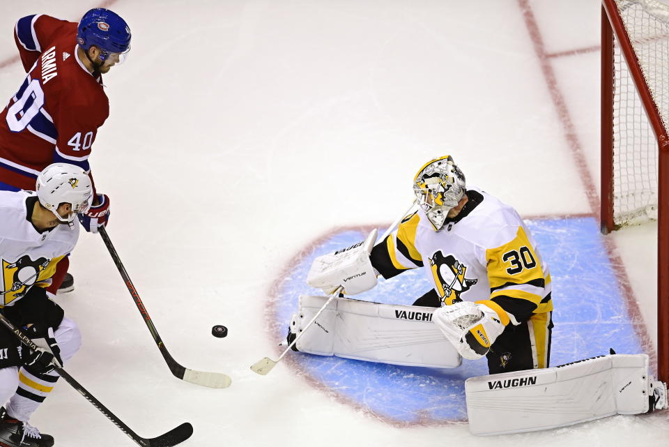 Pittsburgh Penguins goaltender Matt Murray (30) makes a save on Montreal Canadiens' Joel Armia (40) during the second period of an NHL hockey playoff game Wednesday, Aug. 5, 2020 in Toronto. (Frank Gunn/The Canadian Press via AP)