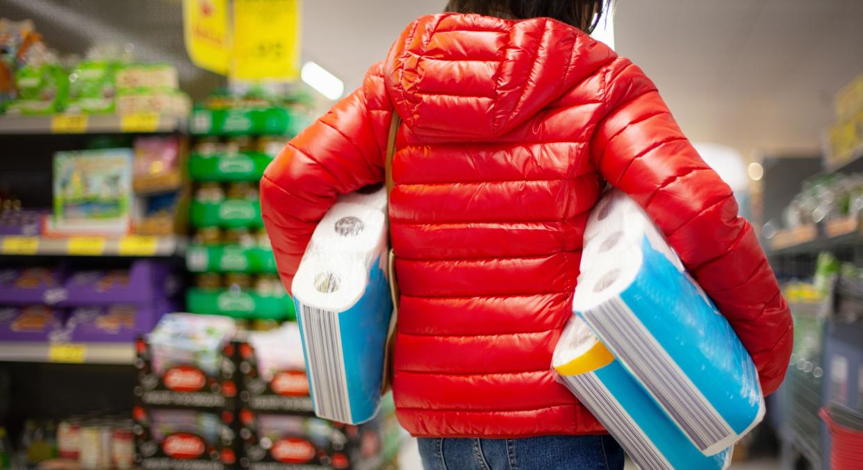 A shopkeeper posted signs around his store encouraging people to buy only what they really need (Getty Images)