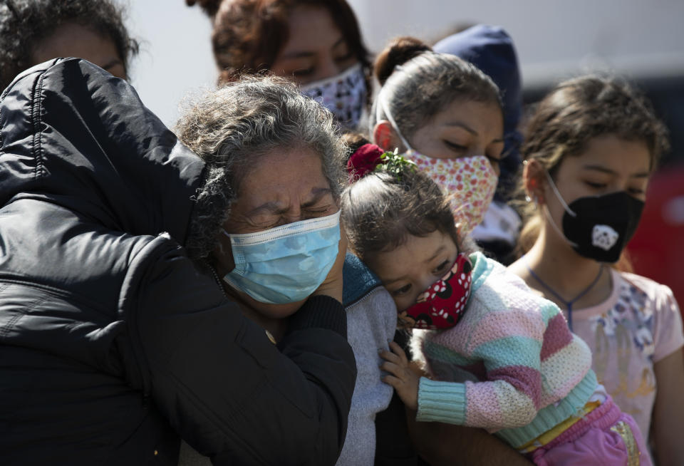 Relatives bury Isaac Nolasco who died of reasons not believed related to COVID-19, in a section of the municipal cemetery Valle de Chalco amid the new coronavirus pandemic, on the outskirts of Mexico City, Sunday, Oct. 25, 2020. Mexican families traditionally flock to local cemeteries to honor their dead relatives as part of the "Dia de los Muertos," or Day of the Dead celebrations, but according to authorities, the cemeteries will be closed this year to help curb the spread of COVID-19. (AP Photo/Marco Ugarte)