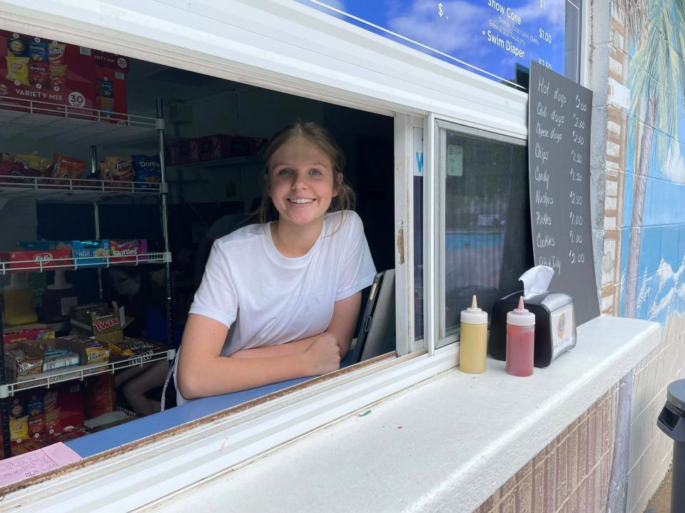 Ava Watts, 14, said she’s too young to be a lifeguard so a position in the concession stand is perfect for her at the Lions Club Karns Community Pool opening day Saturday, May 28, 2022.