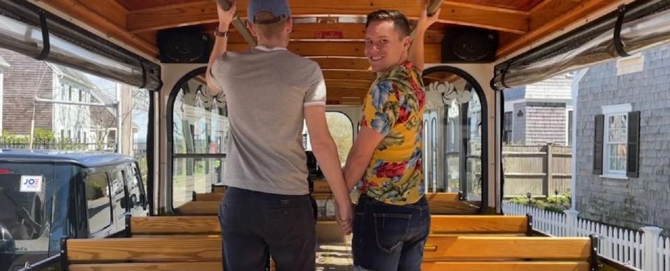 Cabaret performer Seth Sikes, right, holds hands with Provincetown Town Manager Alex Morse as part of a music video of "The Trolley Song" filmed in town last year.