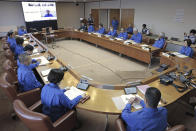 A crisis-management task force meeting is held at prefectural headquarters in Okinawa, southern Japan Tuesday, May 28, 2024. A rocket launched by North Korea to deploy the country's second spy satellite exploded shortly after liftoff Monday, state media reported, in a setback for leader Kim Jong Un's hopes to field satellites to monitor the U.S. and South Korea. (Kyodo News via AP)