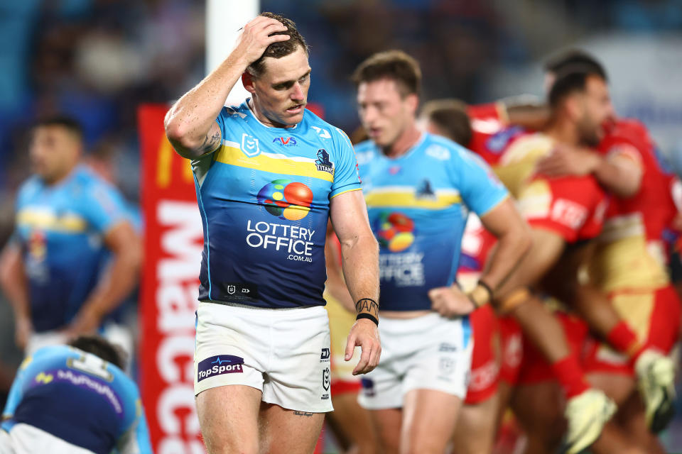 GOLD COAST, AUSTRALIA - MARCH 30: AJ Brimson of the Titans looks on after a Dolphins try during the round four NRL match between Gold Coast Titans and Dolphins at Cbus Super Stadium, on March 30, 2024, in Gold Coast, Australia. (Photo by Chris Hyde/Getty Images)