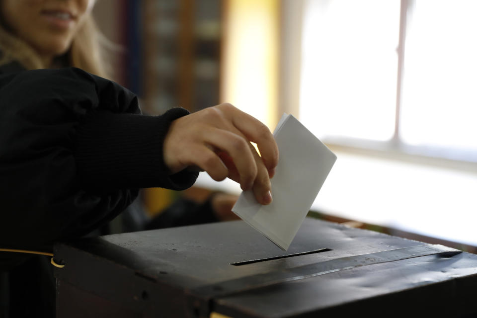 A woman casts her ballot at a polling station in Lisbon, Wednesday, Sept. 4, 2024. Portugal is holding an early general election on Sunday when 10.8 million registered voters elect 230 lawmakers to the National Assembly, the country's Parliament. (AP Photo/Joao Henriques)