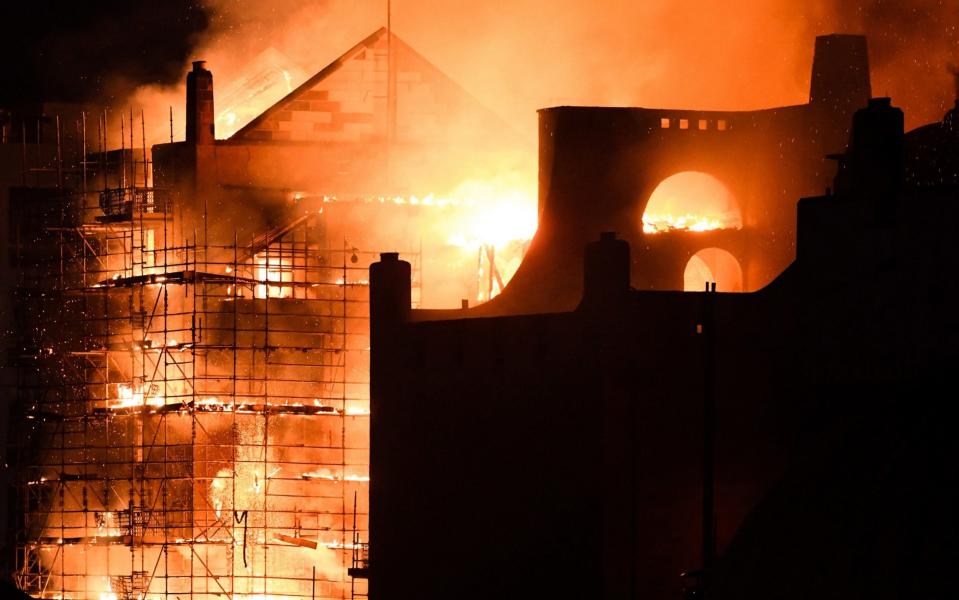 Fire fighters battle a blaze at the Mackintosh Building at the Glasgow School of Art for the second time in four years in June - Getty Images Europe