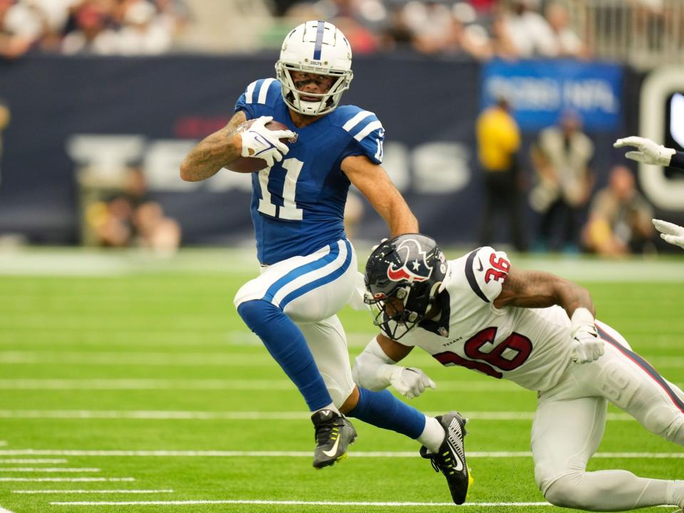 Michael Pittman Jr. runs after a catch against the Houston Texans.