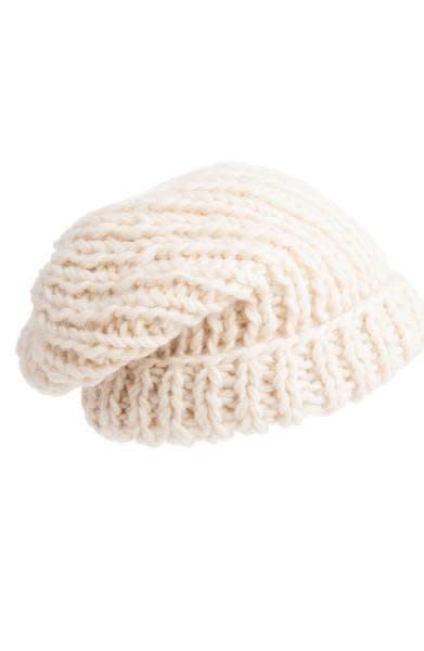 This <a href="https://shop.nordstrom.com/s/nirvanna-designs-chunky-knit-slouchy-wool-cap/4705827?origin=category-personalizedsort&amp;fashioncolor=IVORY" target="_blank">slouchy cap</a> can suit any thickness of hair with its adjustable fold-over cuff.