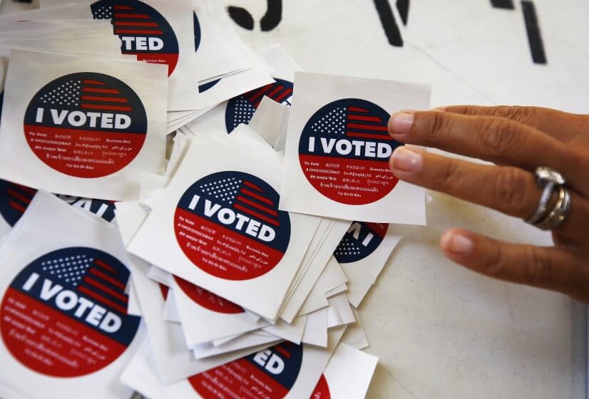 SANTA MONICA, CA - SEPTEMBER 14: "I VOTED" stickers for voters casting their ballots in a vote center at Santa Monica College as polls open Tuesday morning for Californians to decide whether Gov. Gavin Newsom should be removed from office and, if so, who should replace him in a recall election. Santa Monica College on Tuesday, Sept. 14, 2021 in Santa Monica, CA. (Al Seib / Los Angeles Times).