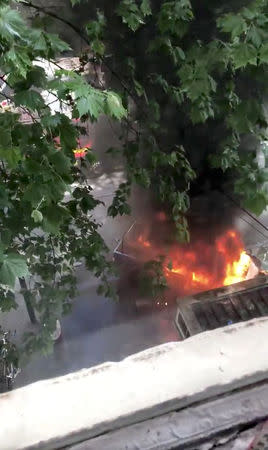 A burning car is seen near the Bourke Street mall, in Melbourne, Australia, November 9, 2018 in this picture grab obtained from social media video. JACK LOVEL/via REUTERS