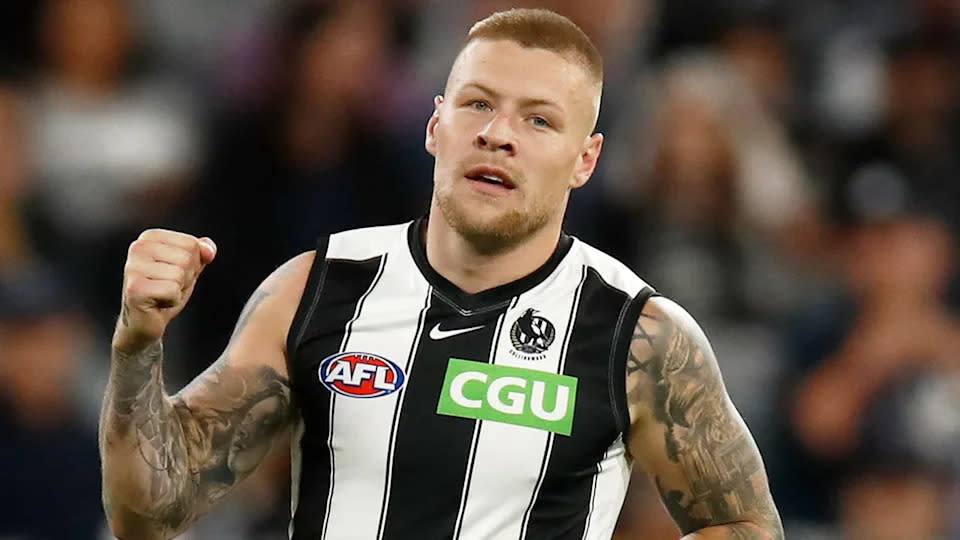 Seen here, Jordan De Goey gives a fist pump during a Collingwood game.