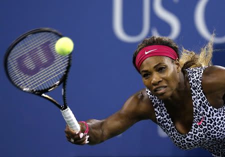 Serena Williams of the U.S. returns a shot to compatriot Taylor Townsend during their women's singles match at the U.S. Open tennis tournament in New York August 26, 2014. REUTERS/Shannon Stapleton