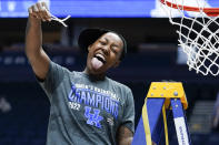 Kentucky's Dre'una Edwards cuts the net after Kentucky beat South Carolina in the NCAA women's college basketball Southeastern Conference tournament championship game Sunday, March 6, 2022, in Nashville, Tenn. Edwards hit the winning shot in Kentucky's 64-62 win. (AP Photo/Mark Humphrey)