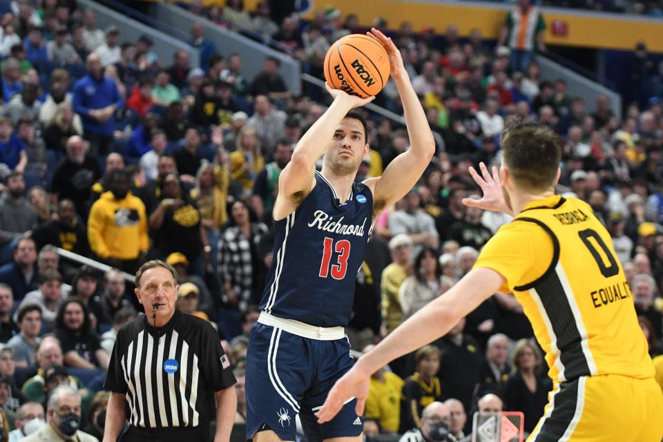 Richmond guard Connor Crabtree eyes the basket in the 12th-seeded Spiders' upset of No. 5 seed Iowa in Buffalo.